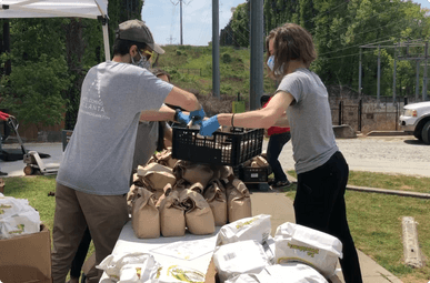 Image of teammate and myself volunteering